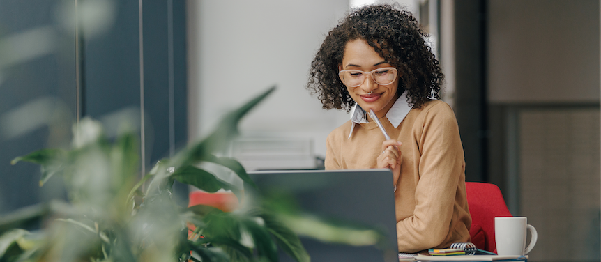 woman thinking laptop